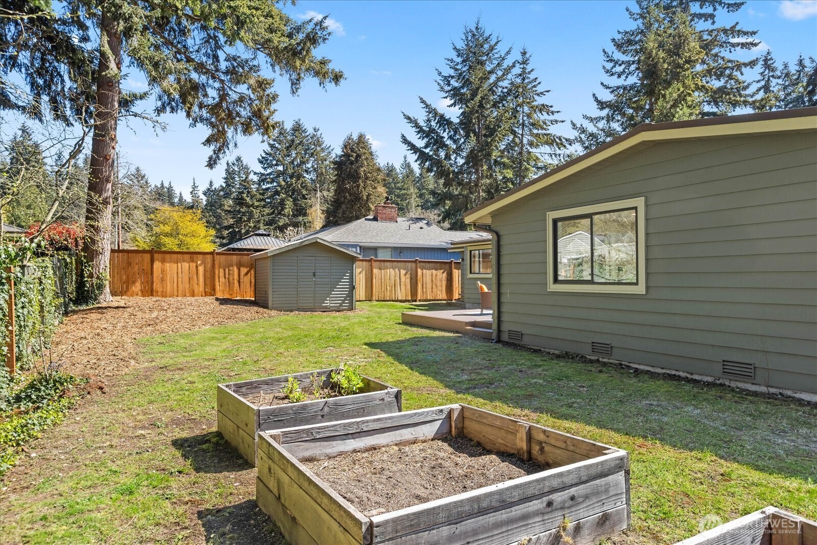 10601 242nd Place Southwest Edmonds, WA 98020 - Photo 31 of 35 a view of a backyard with a garden