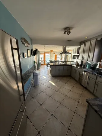 a kitchen with stainless steel appliances lots of counter top space