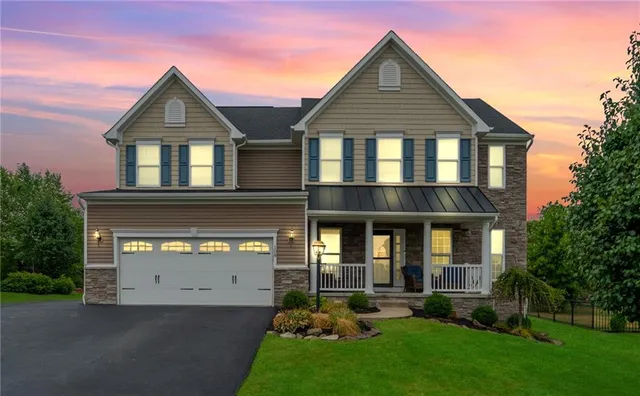 front view of a house with a yard