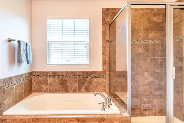 a bath tub sitting next to a window