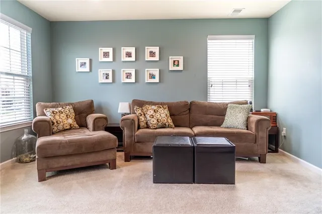 a room that has a chair and a flat screen tv