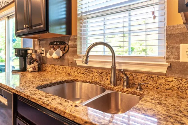 a kitchen with a sink and a window