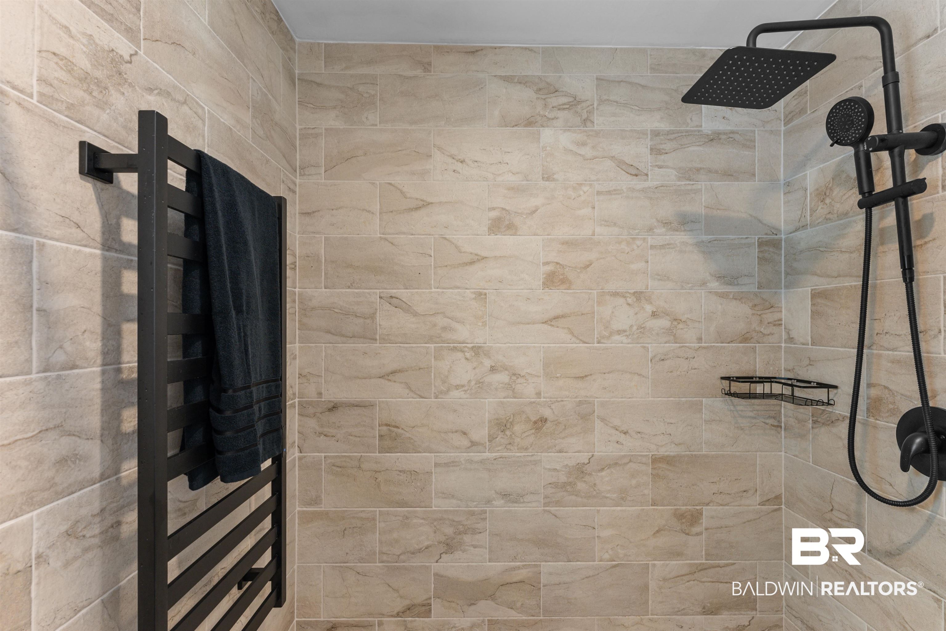 6447 Bemis Lane Bon Secour, AL 36511 - Photo 33 of 62 Tiled shower with a rainfall showerhead, handheld shower fixture, and matte black finishes
