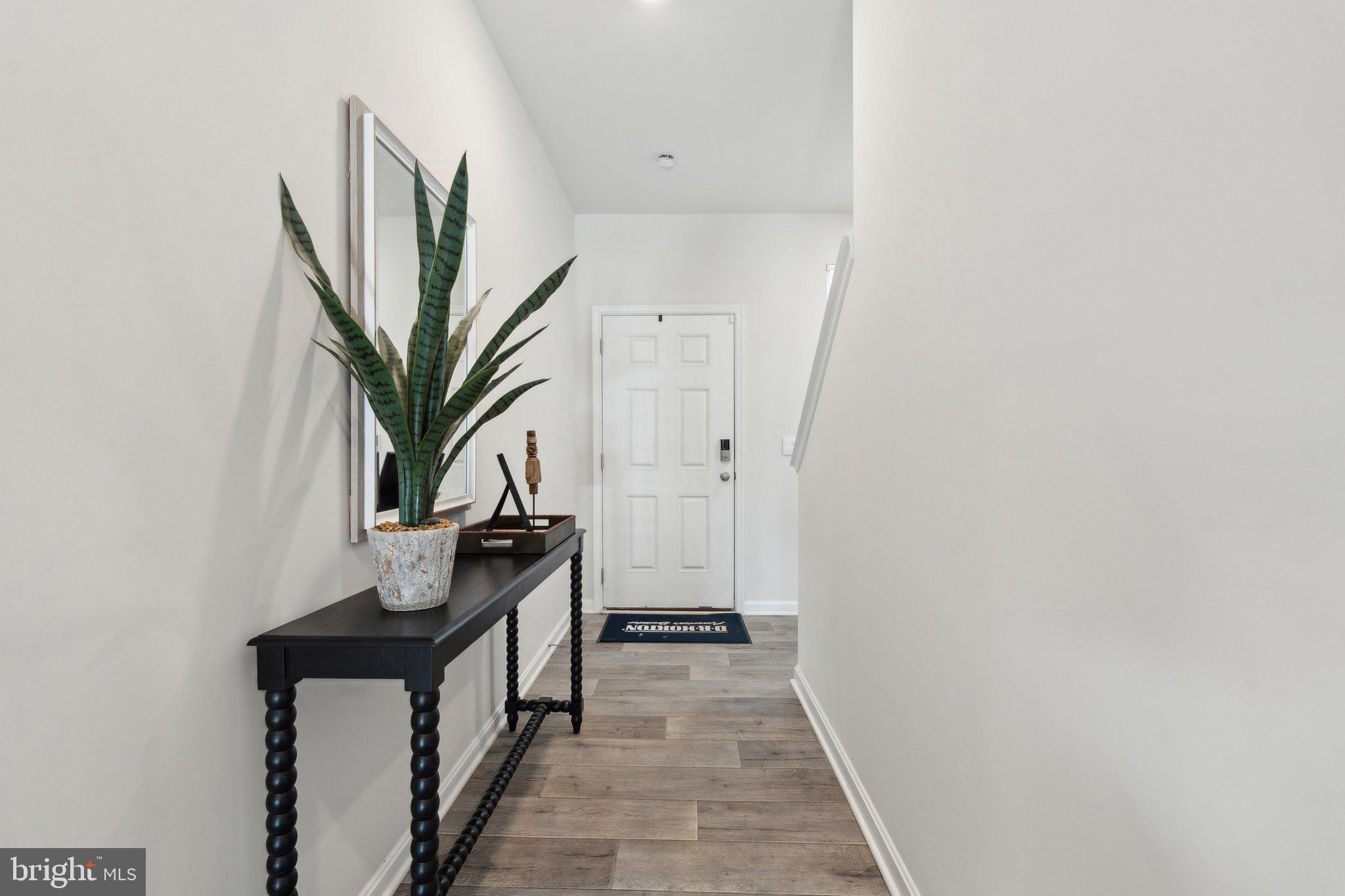 128 Rae Court Luray, VA 22835 - Photo 2 of 30 a view of a hallway with wooden floor and staircase
