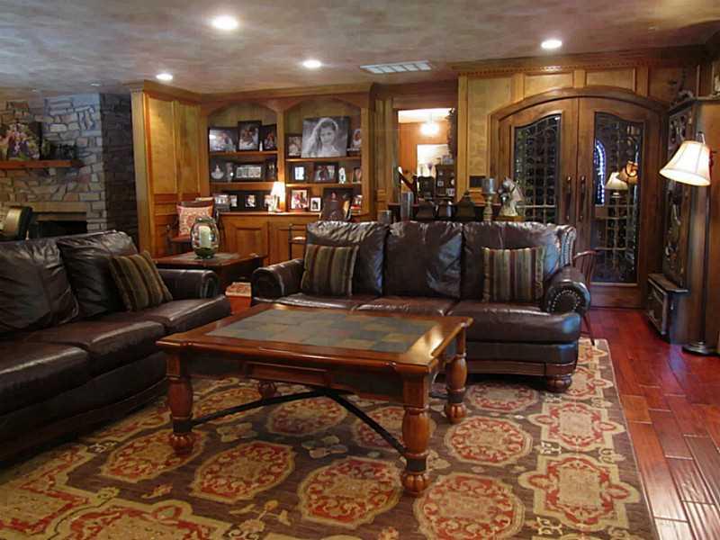 120 South Camp Run Road Fombell, PA 16123 - Photo 2 of 25 Great Room. Great Room with wide plank teak hardwood floor, stone log burning fireplace, built-in bookcases and wine cellar that holds 350 bottles of wine!