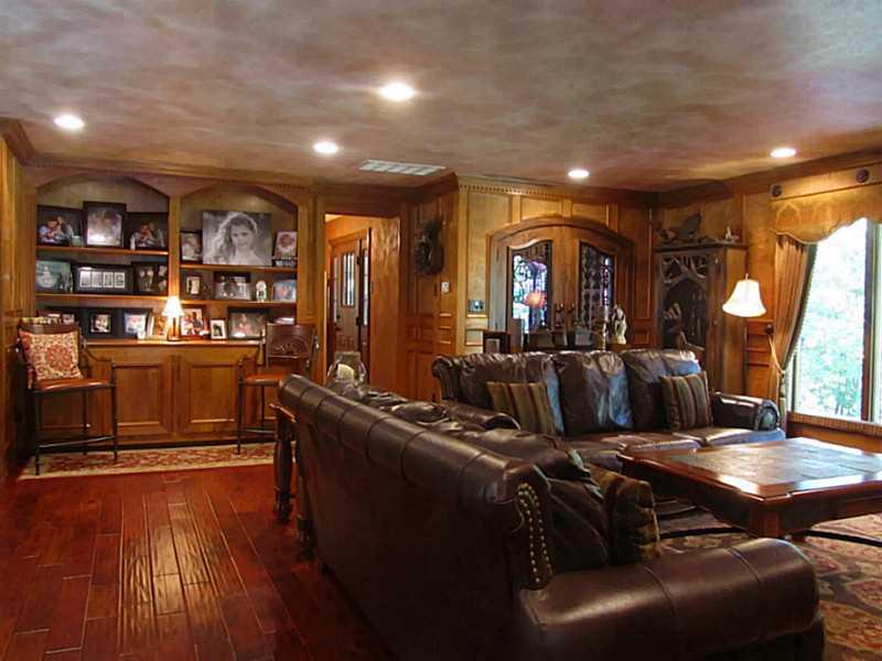 120 South Camp Run Road Fombell, PA 16123 - Photo 3 of 25 Great Room. Great Room with wide plank teak hardwood floor, stone log burning fireplace, built-in bookcases and wine cellar that holds 350 bottles of wine! Large window with custom window treatments (included). Crown molding and recessed lights.