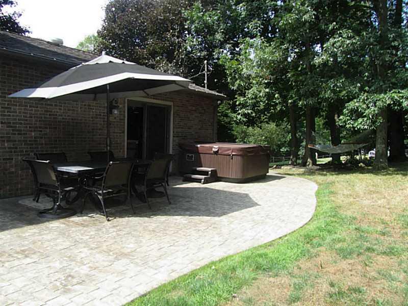 120 South Camp Run Road Fombell, PA 16123 - Photo 22 of 25 Patio/Deck. Stamped, dyed concrete patio in back yard. Hot tub and hammock included. Sliding doors to Great Room.