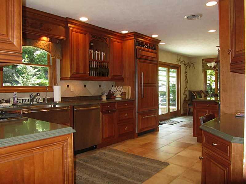 120 South Camp Run Road Fombell, PA 16123 - Photo 6 of 25 Kitchen. Large Kitchen with ceramic floor, cherry cabinets with Corian tops, paneled SubZero refrigerator, 5 burner gas cook top, stainless steel double ovens, stainless steel dishwasher, deep stainless steel sink with reverse osmosis drinking water! Sliding door