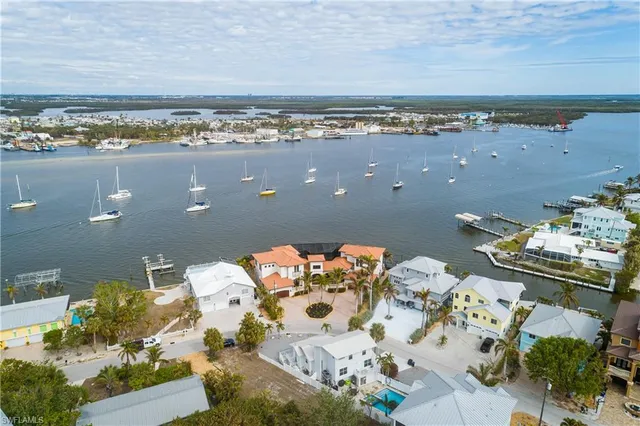 an aerial view of a house with a ocean view