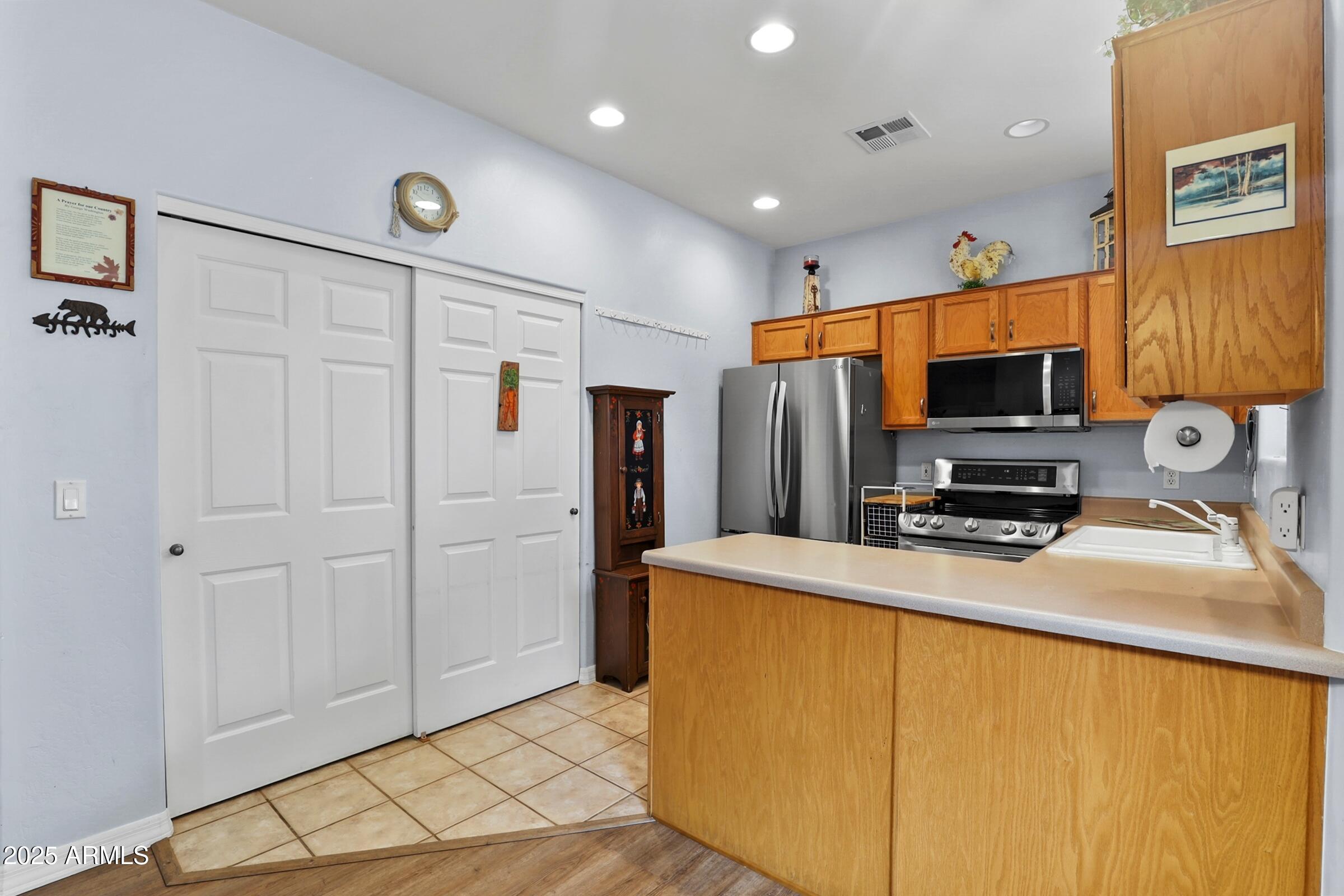 300 West Cody Circle Payson, AZ 85541 - Photo 13 of 25 a kitchen with stainless steel appliances a refrigerator and a stove top oven