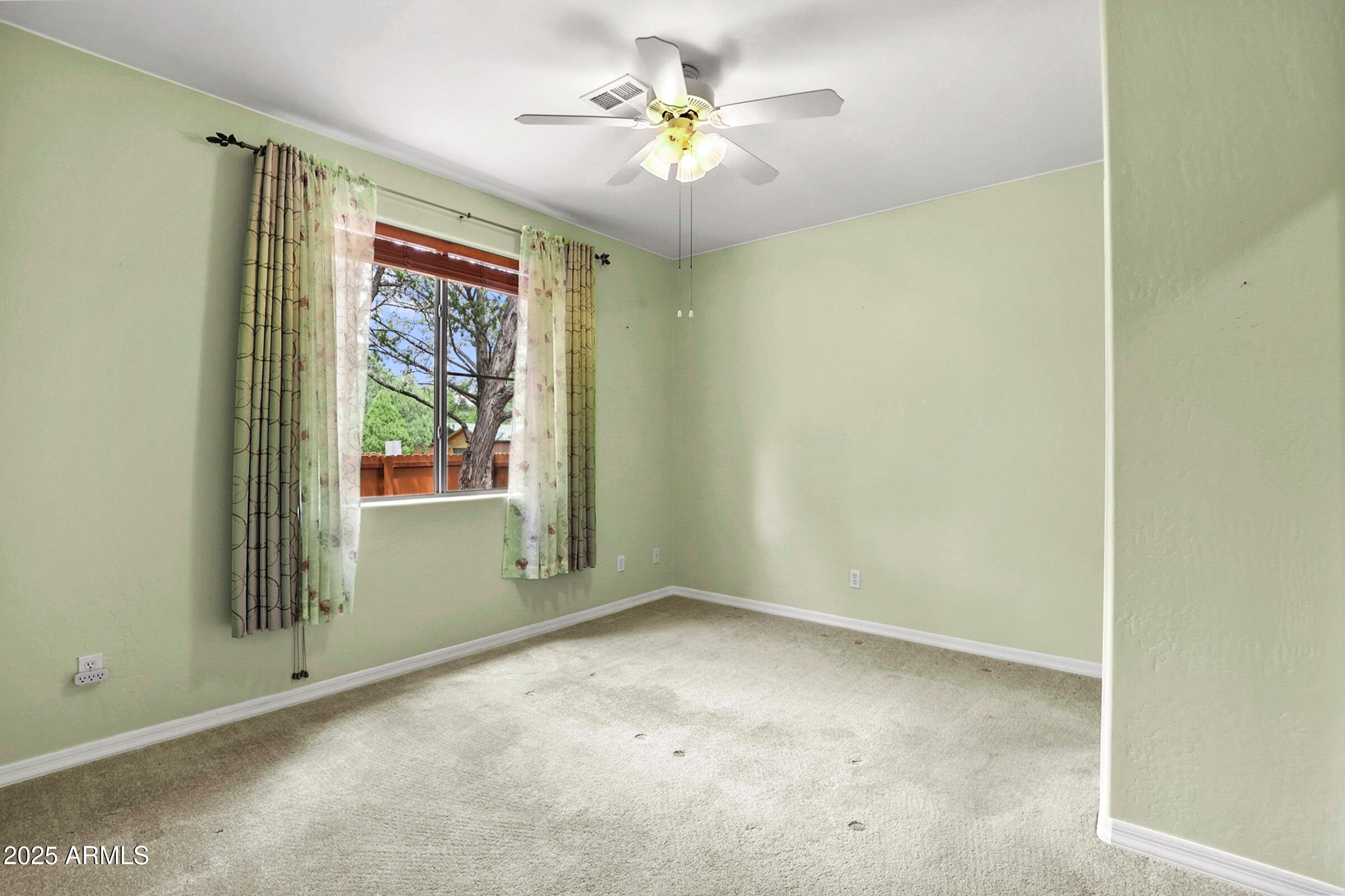 300 West Cody Circle Payson, AZ 85541 - Photo 16 of 25 an empty room with windows and fan