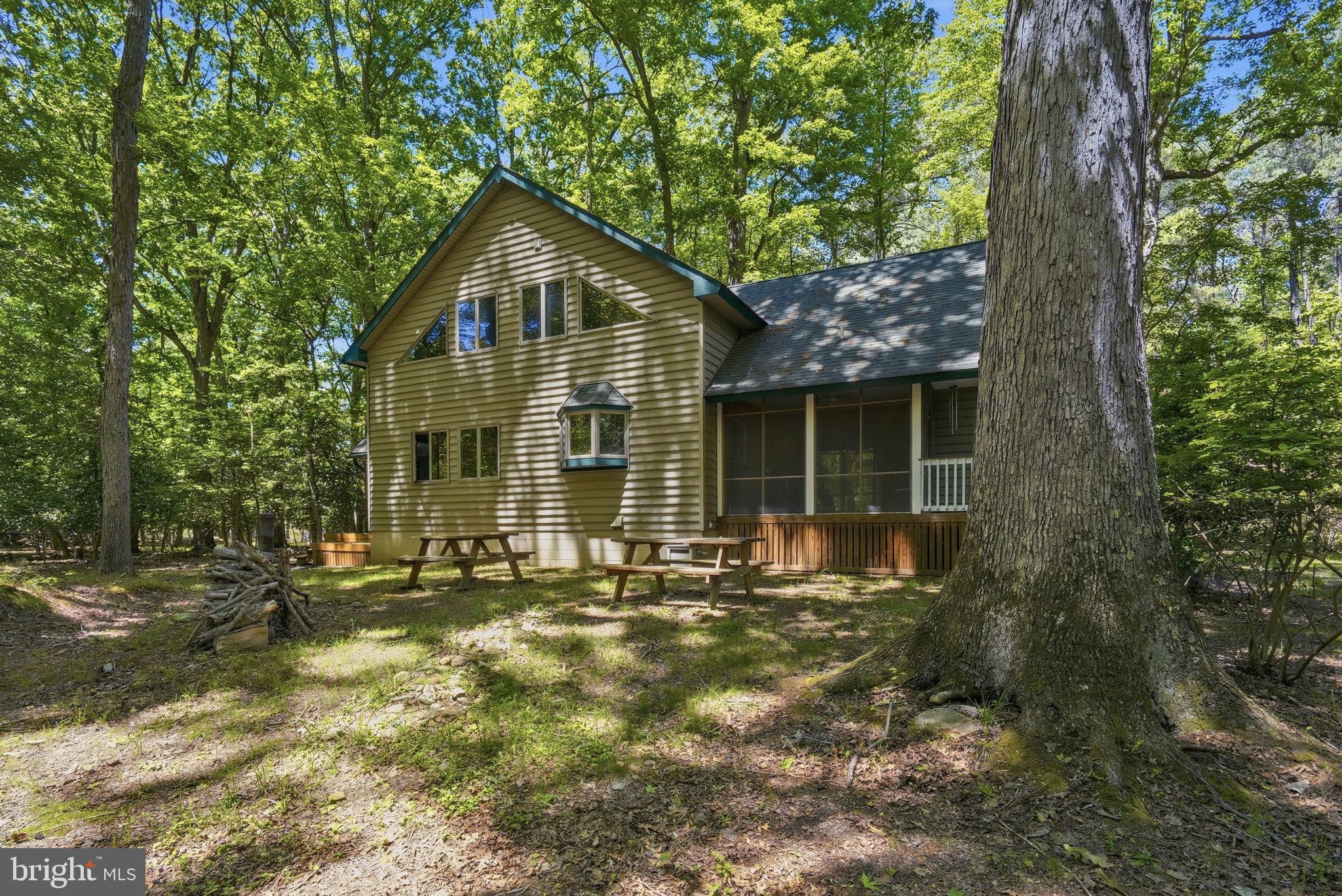 22300 Frazier Road Rock Hall, MD 21661 - Photo 3 of 38 a front view of a house with a yard