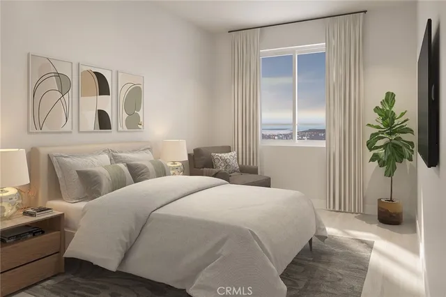 a bedroom with bed and a potted plant