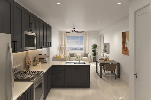 a kitchen with stainless steel appliances kitchen island granite countertop a sink stove and cabinets