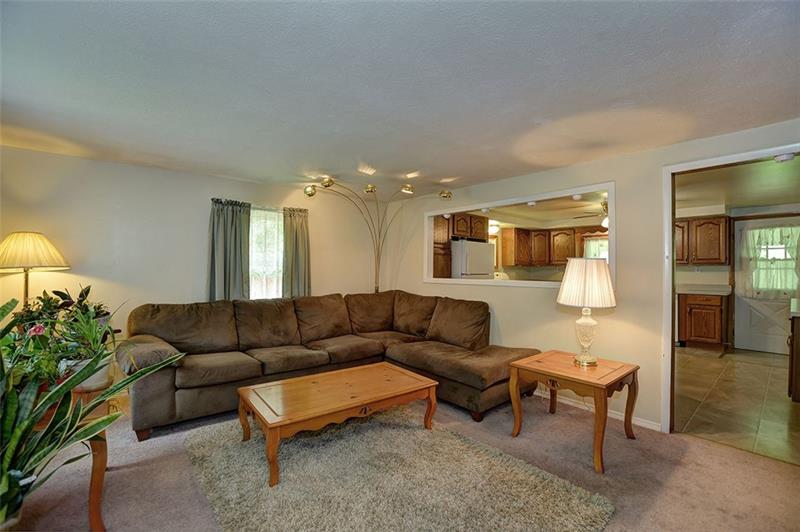 117 Landell Street Rochester, PA 15074 - Photo 3 of 19 Plenty of room for furniture arrangement in the living room open to the kitchen.