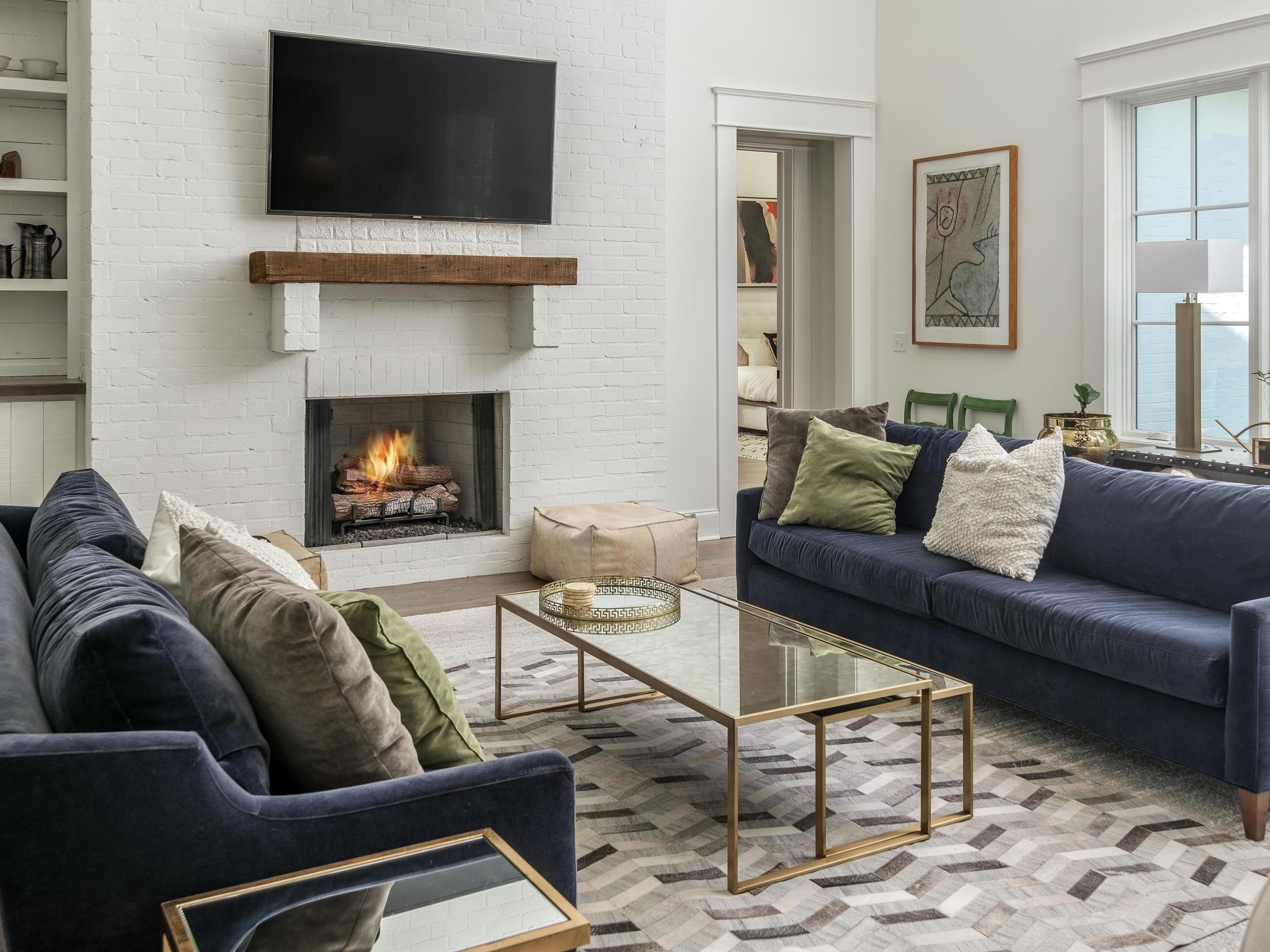 3520 Trimble Road Nashville, TN 37215 - Photo 16 of 44 a living room with furniture a flat screen tv and a fireplace