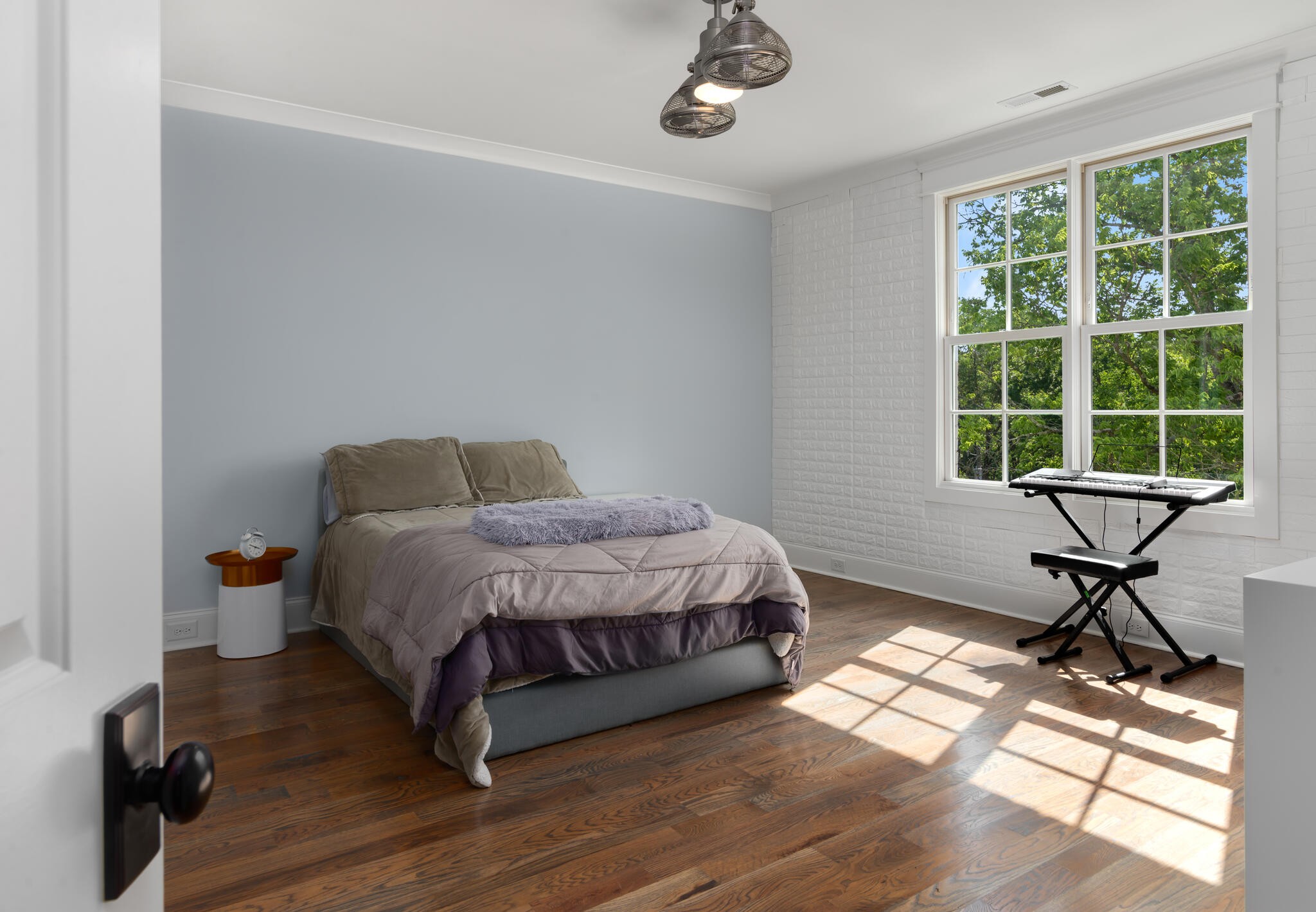 3520 Trimble Road Nashville, TN 37215 - Photo 33 of 44 a bedroom with a bed and wooden floor