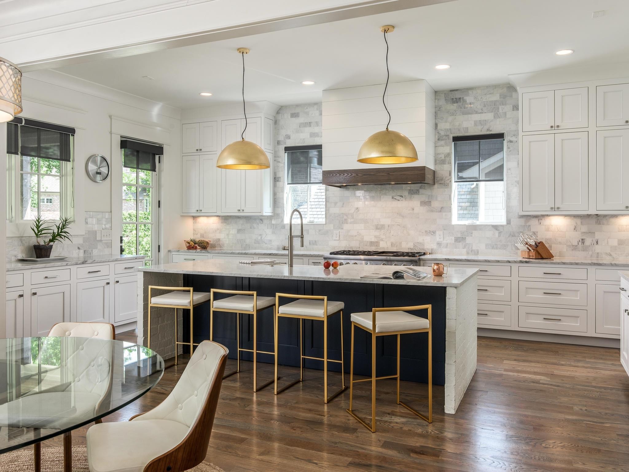 3520 Trimble Road Nashville, TN 37215 - Photo 9 of 44 a kitchen with granite countertop a stove a sink a dining table and chairs