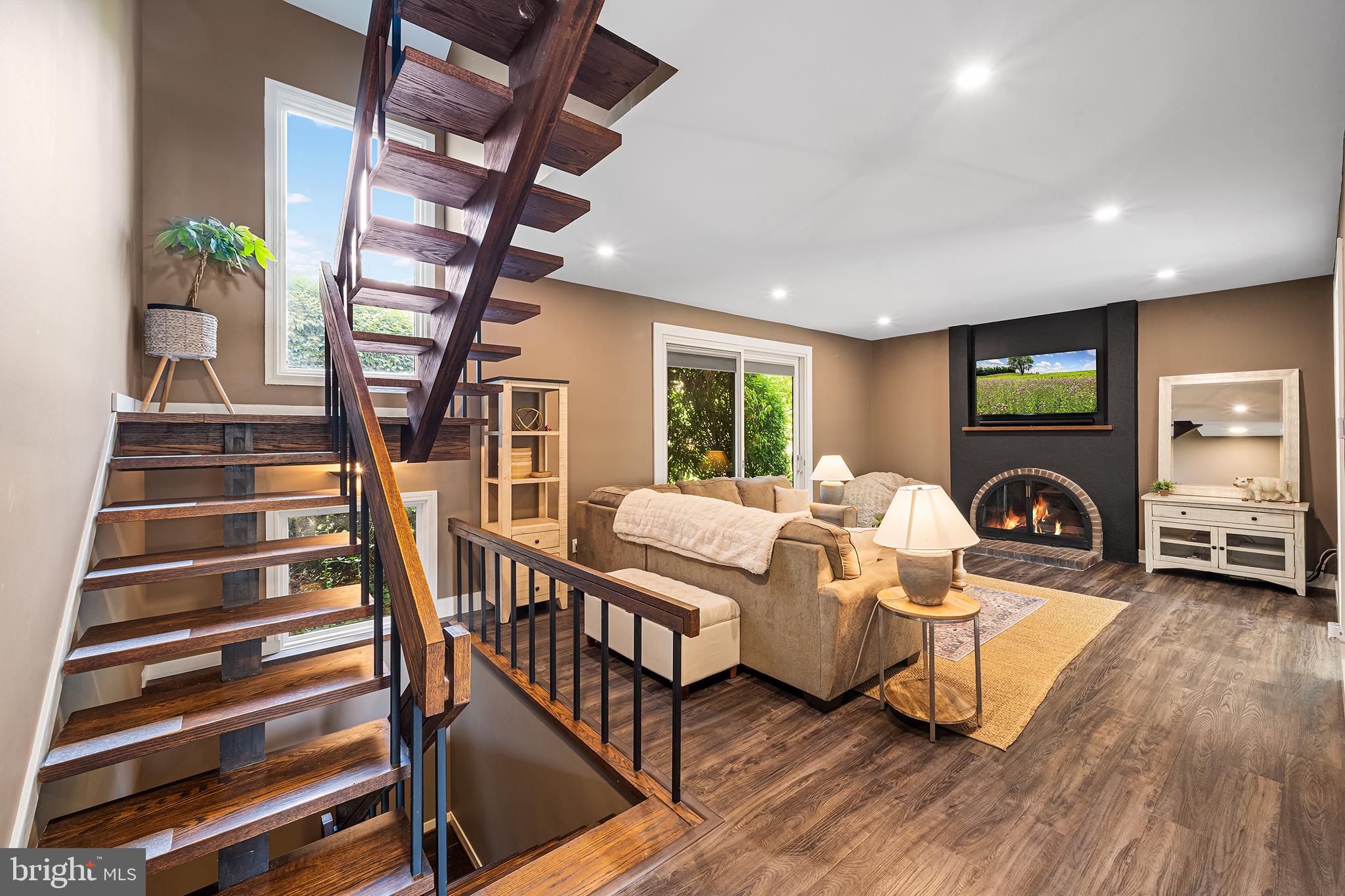 11 Brettagne Devon, PA 19333 - Photo 12 of 39 Living room with wood burning fireplace