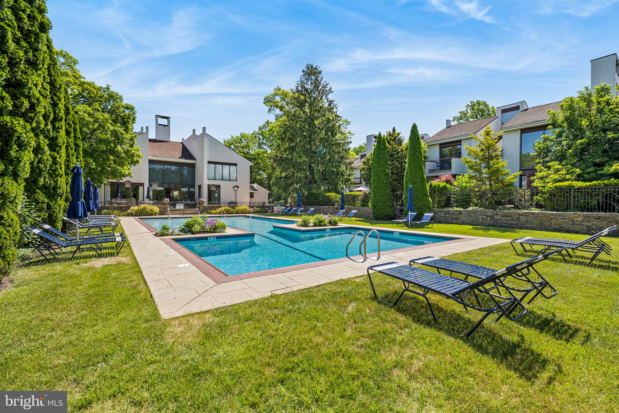 11 Brettagne Devon, PA 19333 - Photo 35 of 39 Outdoor pool with chaise lounge chairs