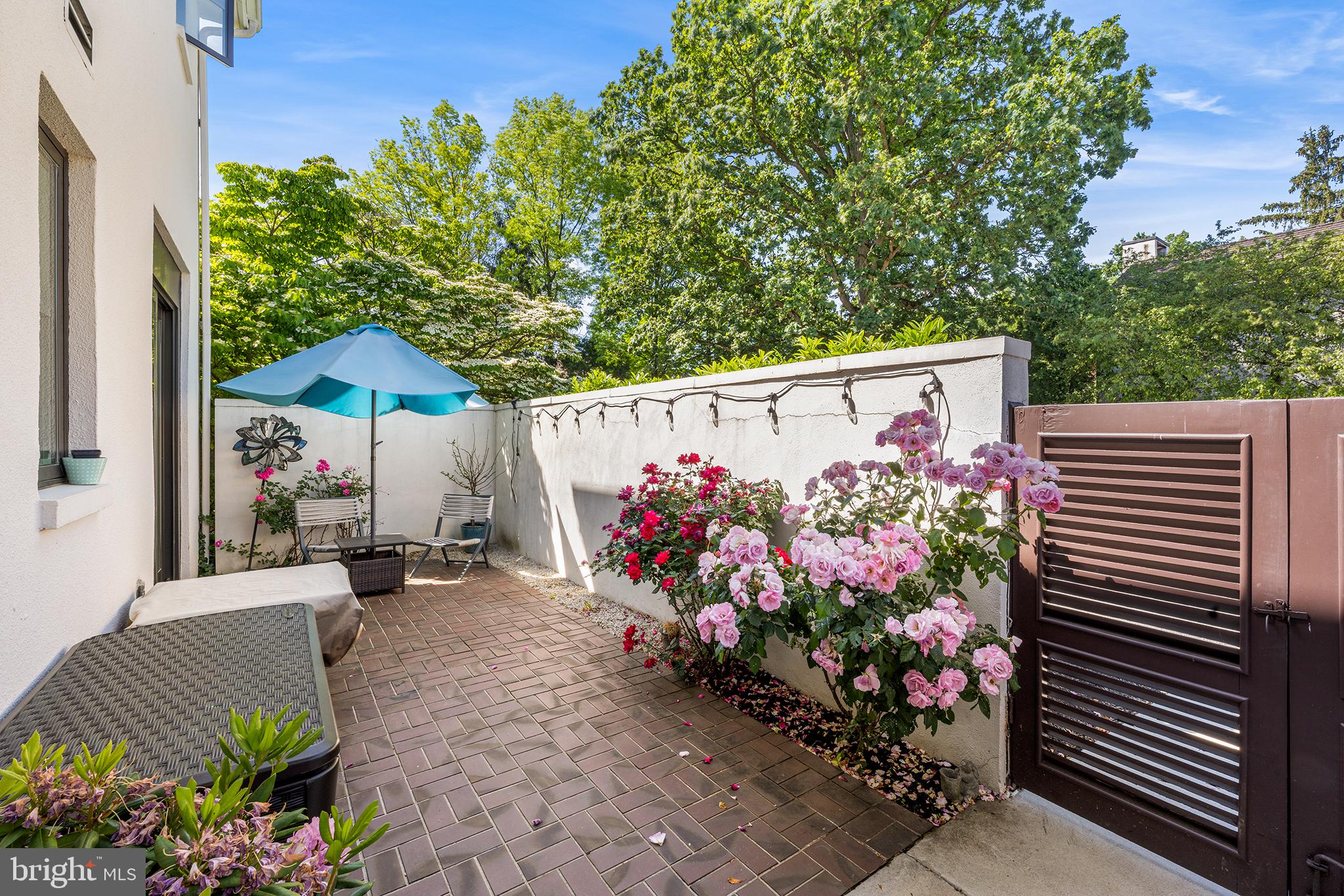 11 Brettagne Devon, PA 19333 - Photo 4 of 39 Exterior patio full of roses