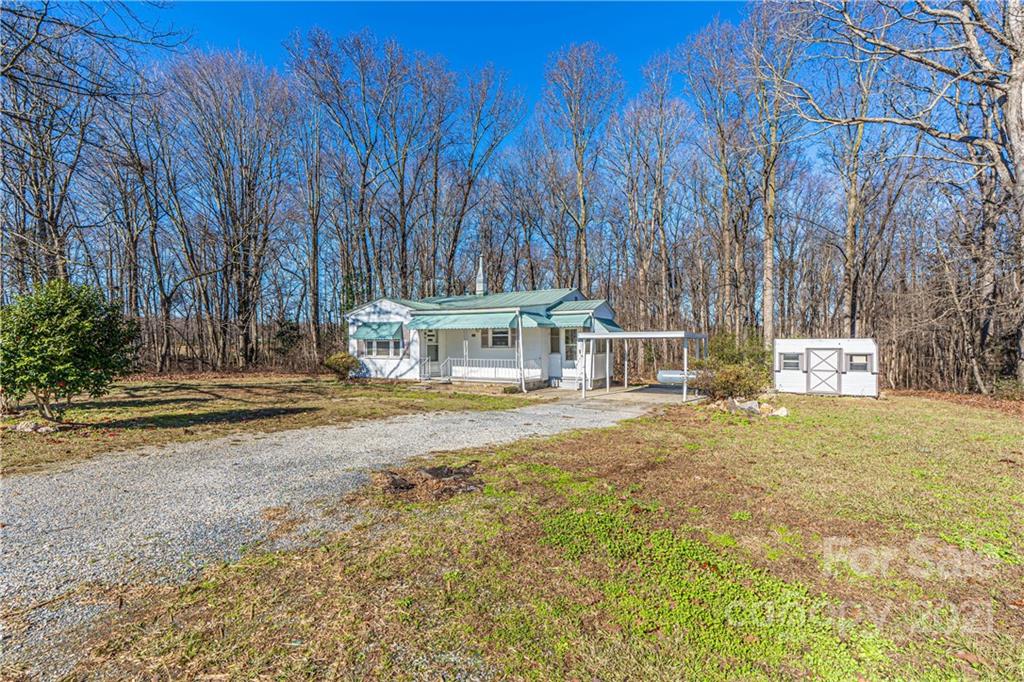 147 Davis Road Seagrove, NC 27341 - Photo 3 of 31 a view of a house with a yard and sitting area