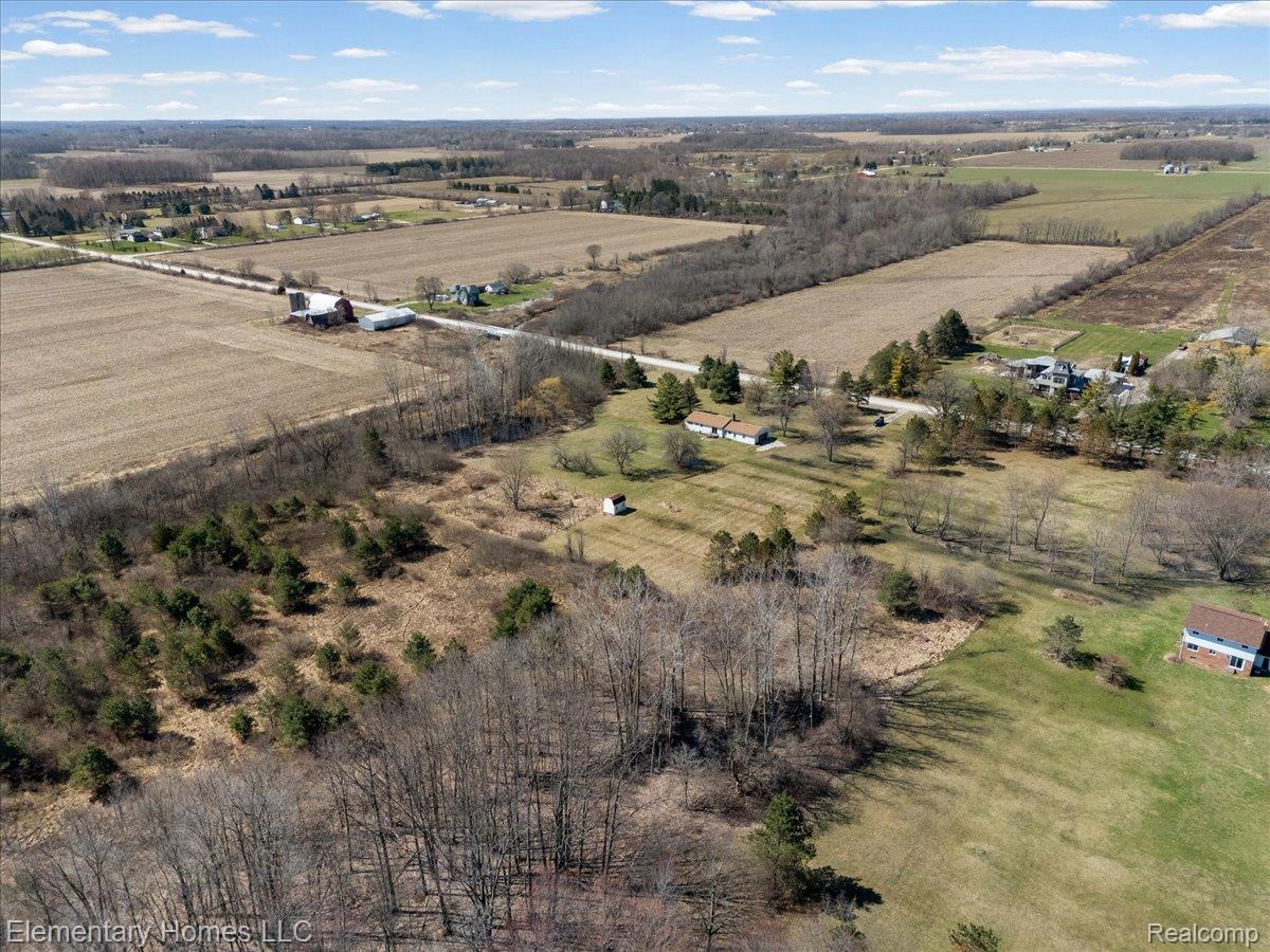 1650 Cove Road Goodells, MI 48027 - Photo 12 of 49 Aerial view of sparsely populated area featuring rows of crops