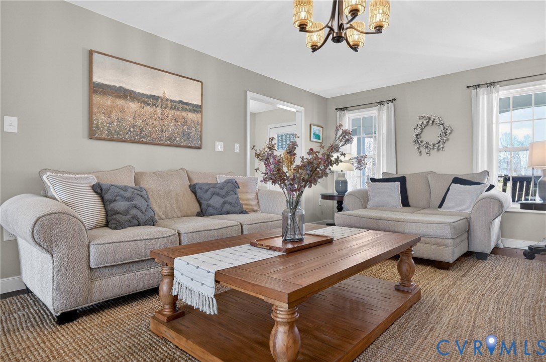 2092 Leigh Mountain Road Green Bay, VA 23942 - Photo 16 of 72 a living room with furniture a chandelier and a window