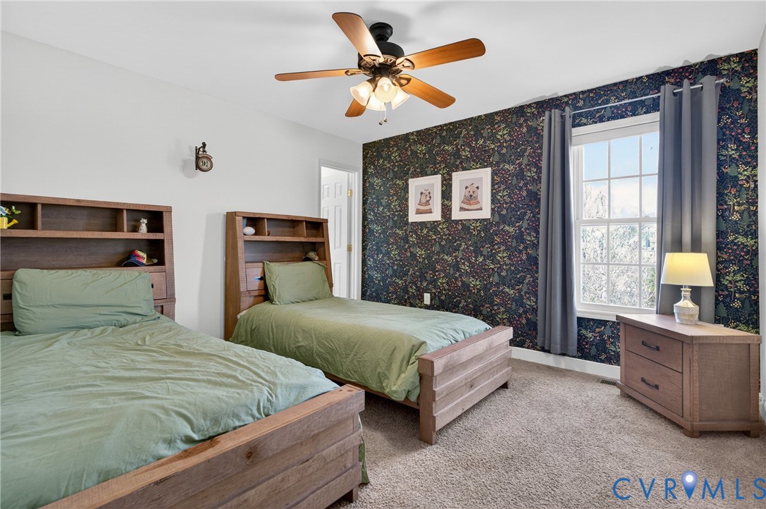 2092 Leigh Mountain Road Green Bay, VA 23942 - Photo 41 of 72 a bedroom with double bed and a chandelier