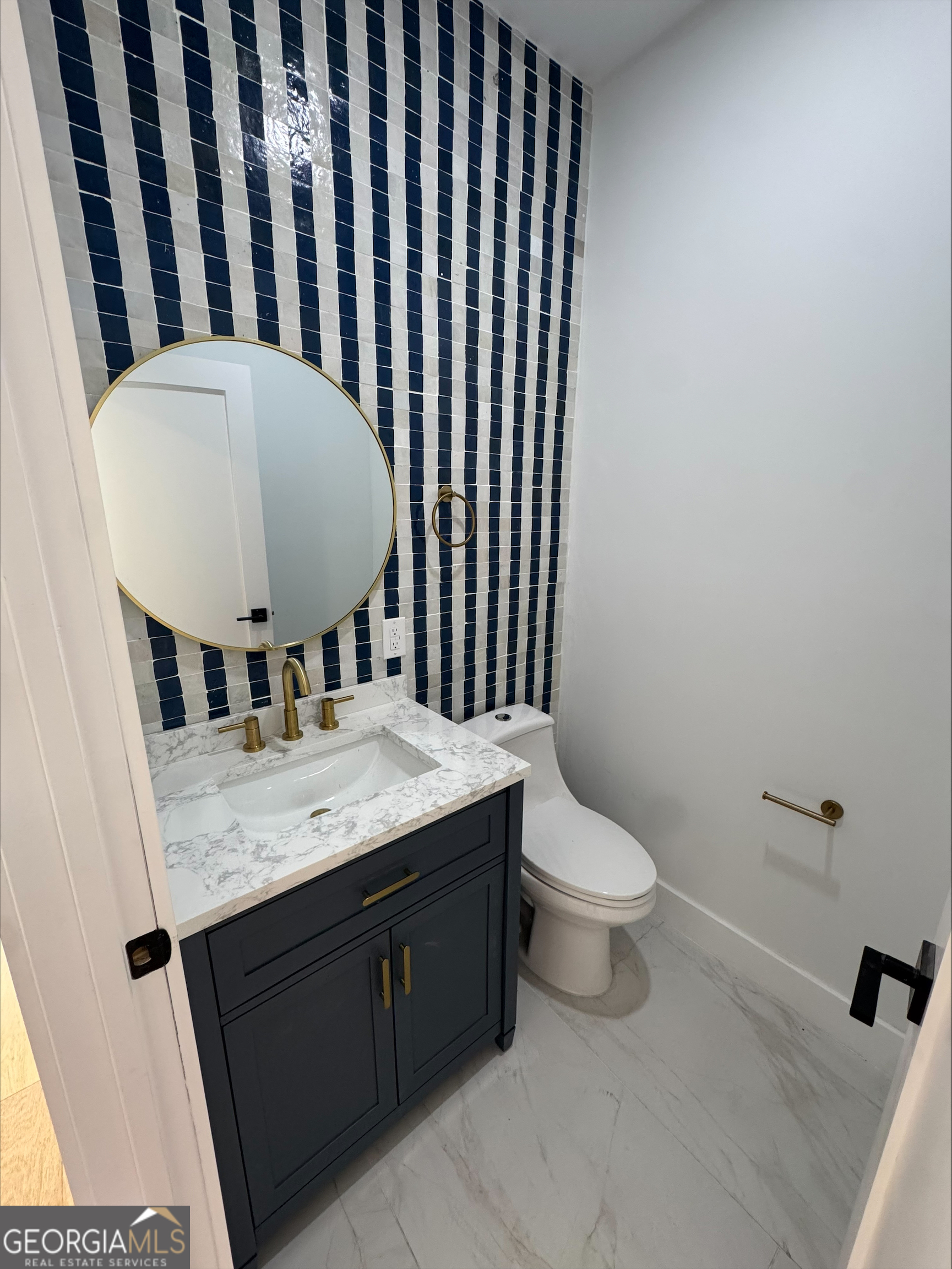 1705 Old Northcutt Road, Unit TR A Ellijay, GA 30536 - Photo 18 of 29 a bathroom with a granite countertop sink and a mirror