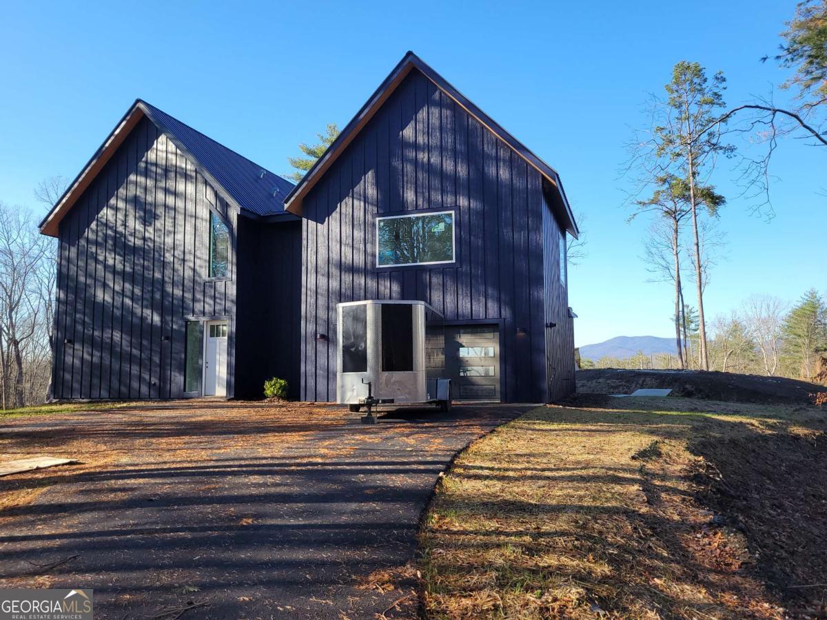 1705 Old Northcutt Road, Unit TR A Ellijay, GA 30536 - Photo 26 of 29 a view of a house with a small yard