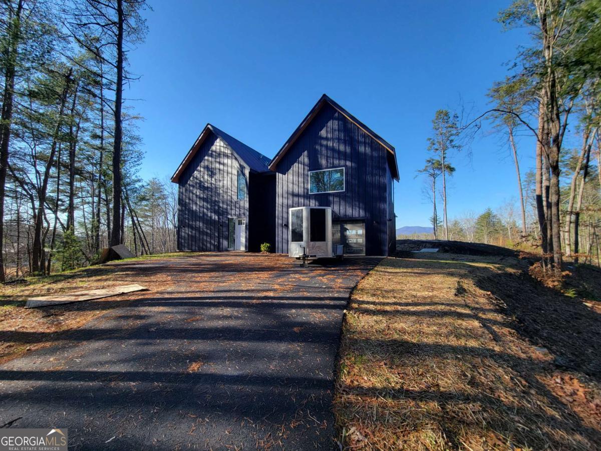 1705 Old Northcutt Road, Unit TR A Ellijay, GA 30536 - Photo 27 of 29 a front view of a house with a yard