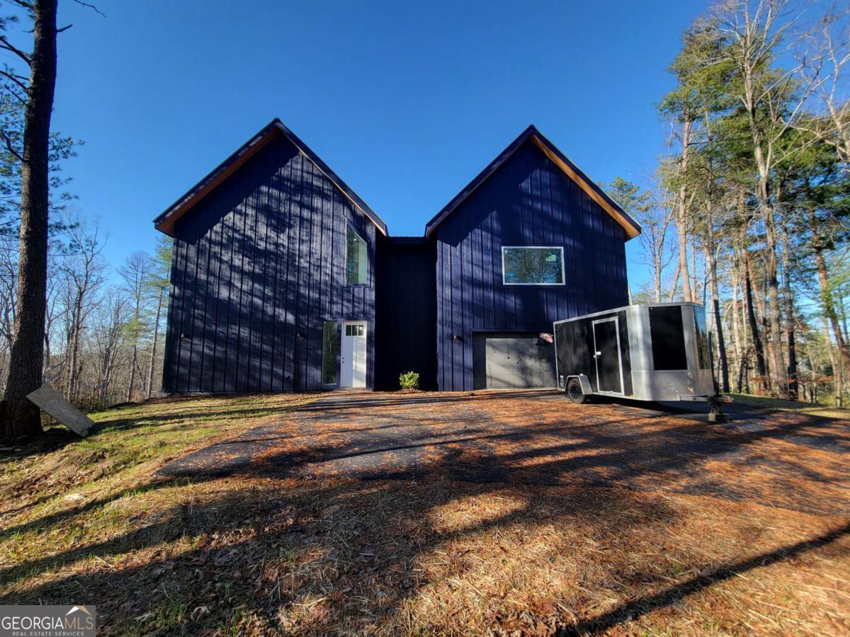 1705 Old Northcutt Road, Unit TR A Ellijay, GA 30536 - Photo 28 of 29 a front view of a house with a yard