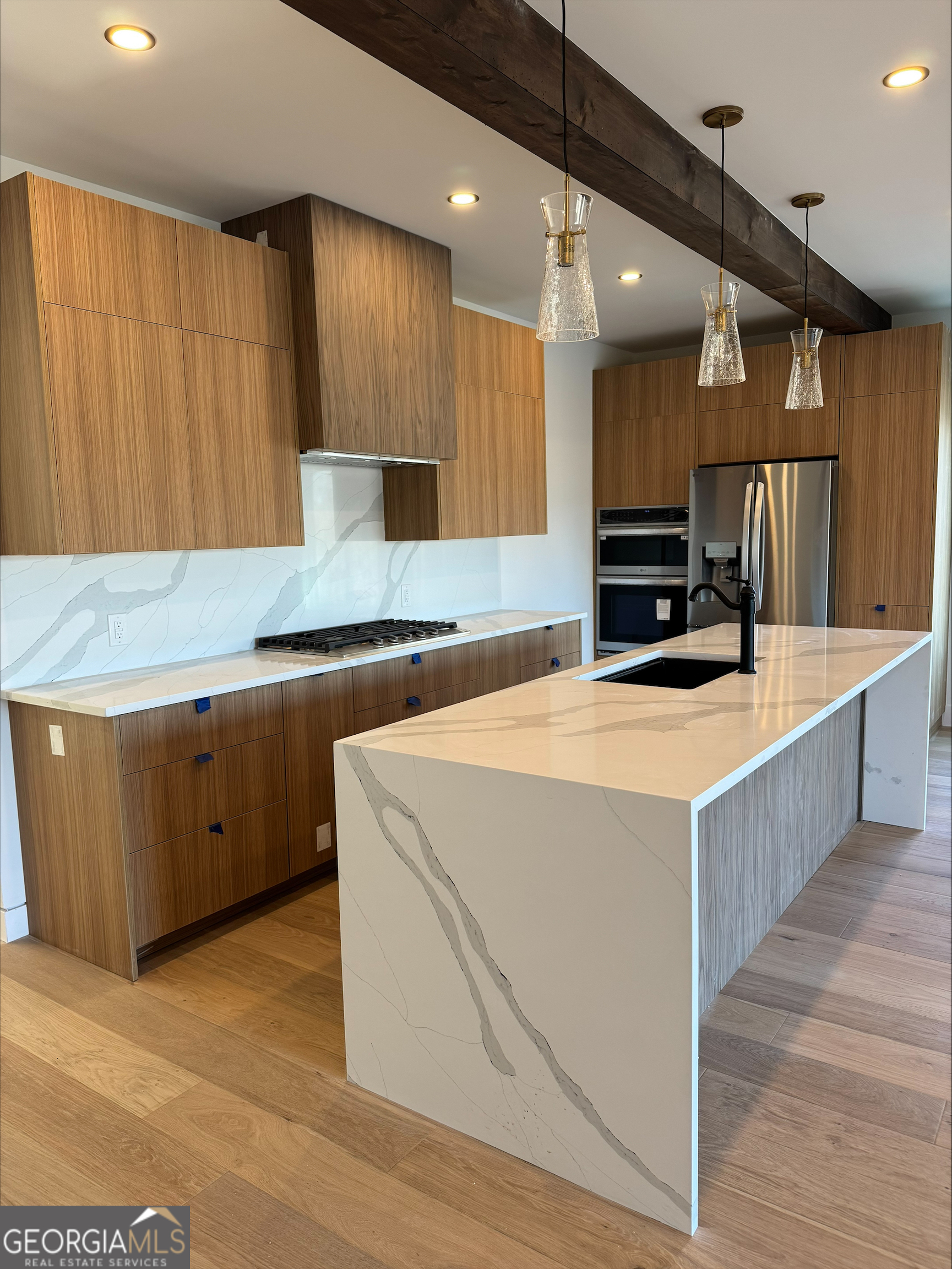 1705 Old Northcutt Road, Unit TR A Ellijay, GA 30536 - Photo 10 of 29 a kitchen with kitchen island a sink stainless steel appliances and cabinets