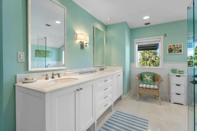 a bathroom with a double vanity sink and a mirror