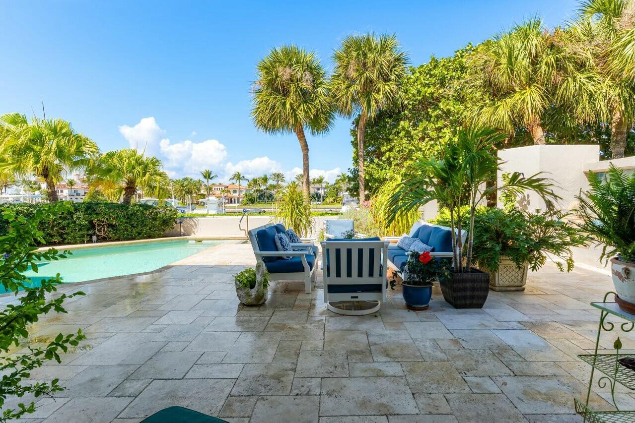 6549 Southeast South Marina Way Stuart, FL 34996 - Photo 45 of 76 a view of a patio with chairs and plants