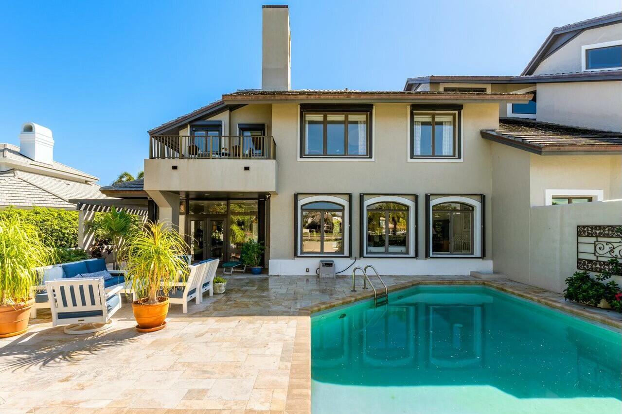 6549 Southeast South Marina Way Stuart, FL 34996 - Photo 49 of 76 a front view of a house with outdoor seating