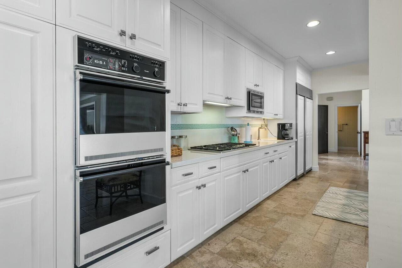 6549 Southeast South Marina Way Stuart, FL 34996 - Photo 10 of 76 a kitchen with granite countertop cabinets and steel stainless steel appliances
