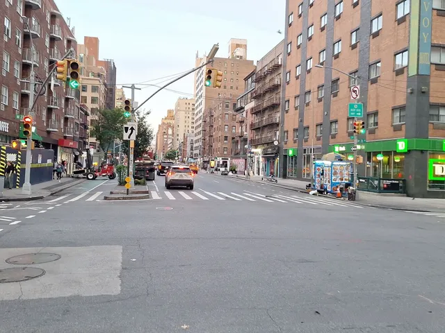 a city street with tall buildings