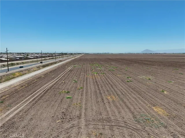 a view of an ocean beach and mountain