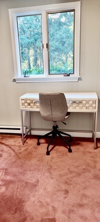 123 Lincoln Road Wayland, MA 01778 - Photo 11 of 26 a living room with a table chair and a window