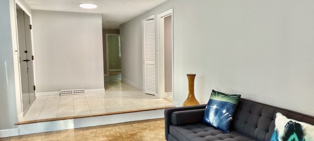 123 Lincoln Road Wayland, MA 01778 - Photo 14 of 26 a living room with furniture and a window
