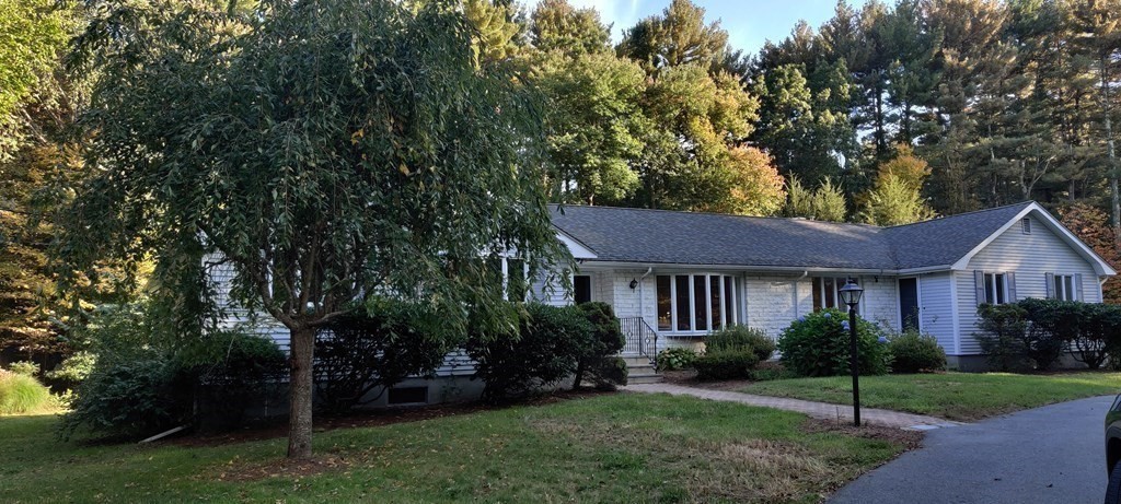 123 Lincoln Road Wayland, MA 01778 - Photo 3 of 26 a house view with a garden space