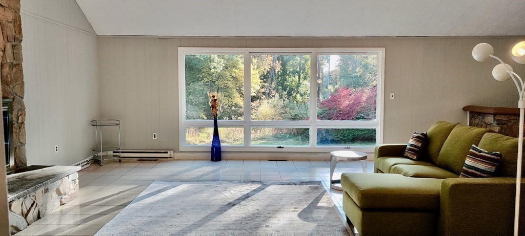 123 Lincoln Road Wayland, MA 01778 - Photo 8 of 26 a living room with furniture and a floor to ceiling window