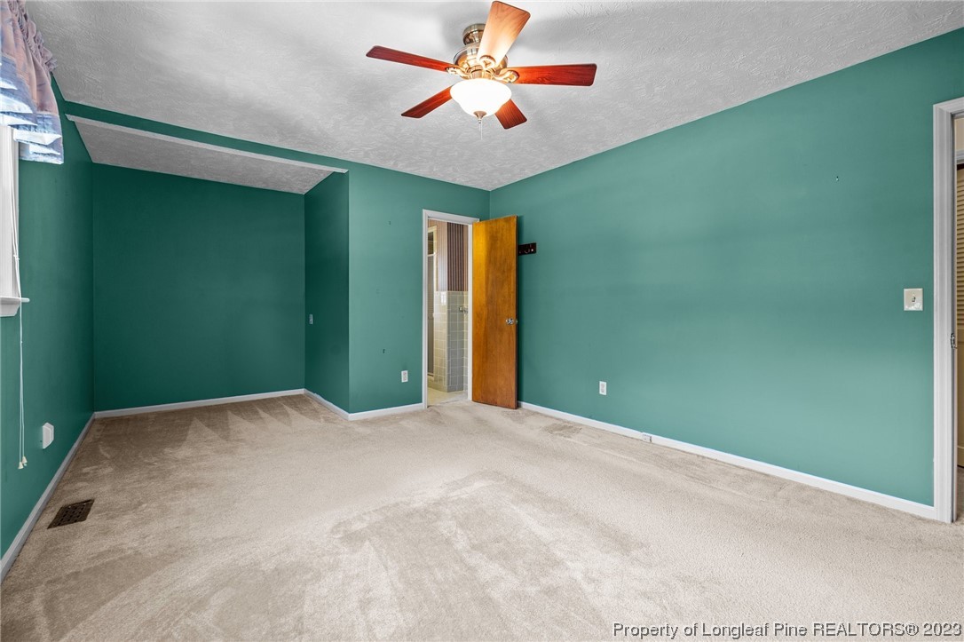 1812 Bainbridge Road Stedman, NC 28391 - Photo 22 of 30 a view of a room with a ceiling fan and window