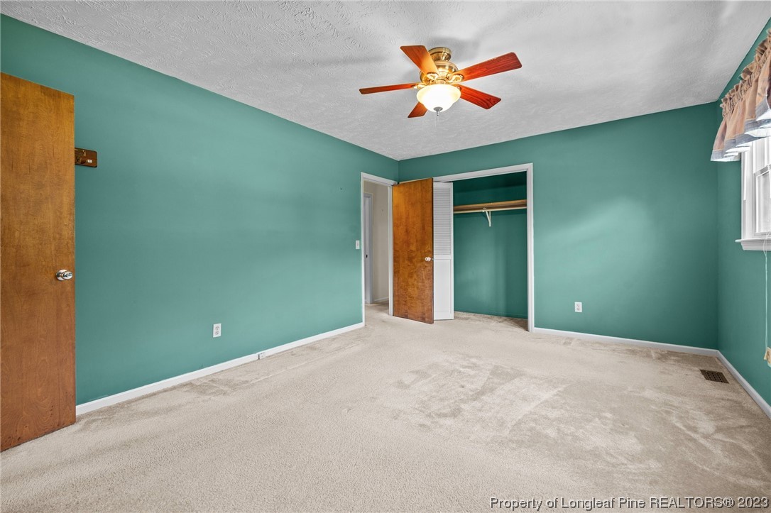 1812 Bainbridge Road Stedman, NC 28391 - Photo 23 of 30 a view of an empty room with window and wooden floor