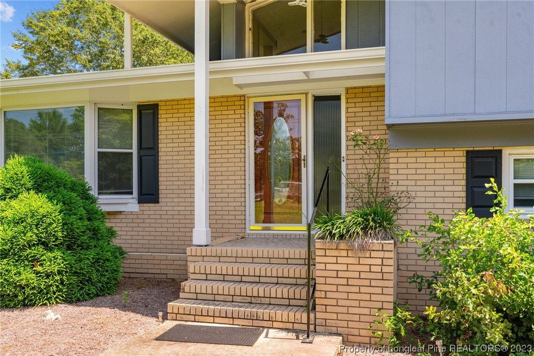 1812 Bainbridge Road Stedman, NC 28391 - Photo 28 of 30 a front view of a house with a garden