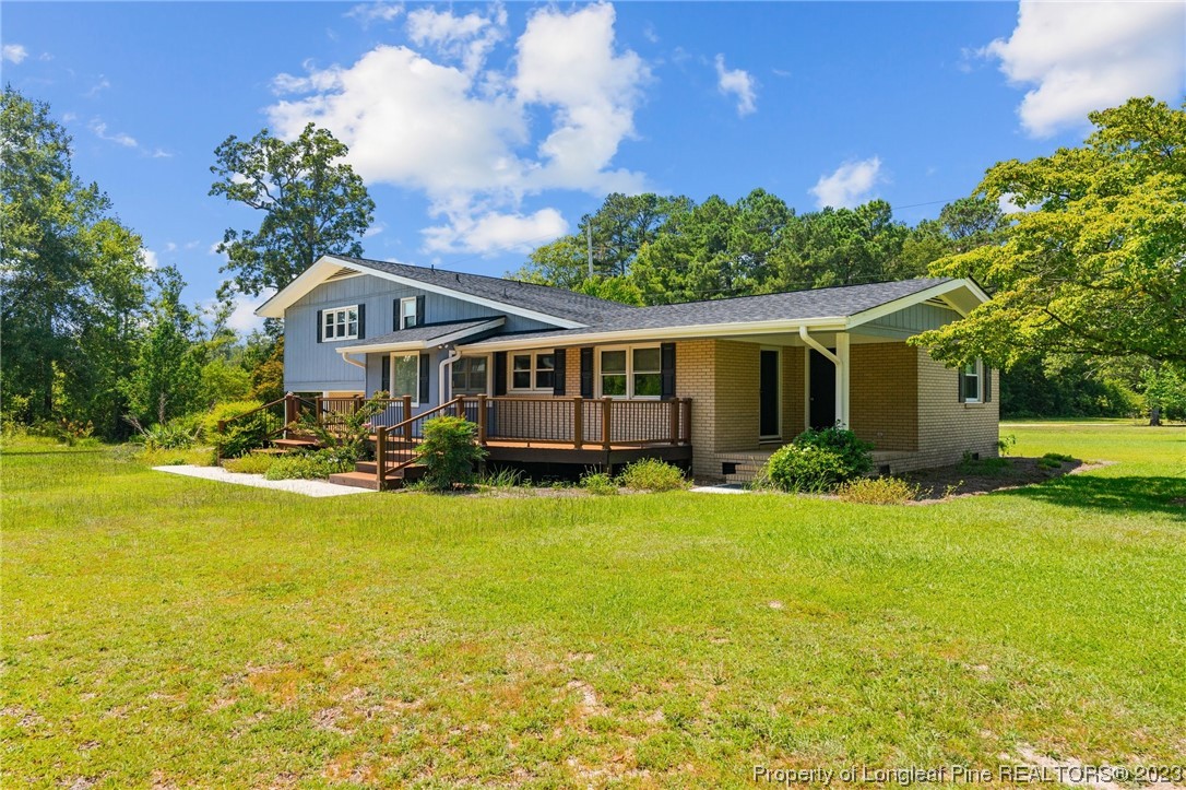 1812 Bainbridge Road Stedman, NC 28391 - Photo 29 of 30 a front view of a house with swimming pool having outdoor seating