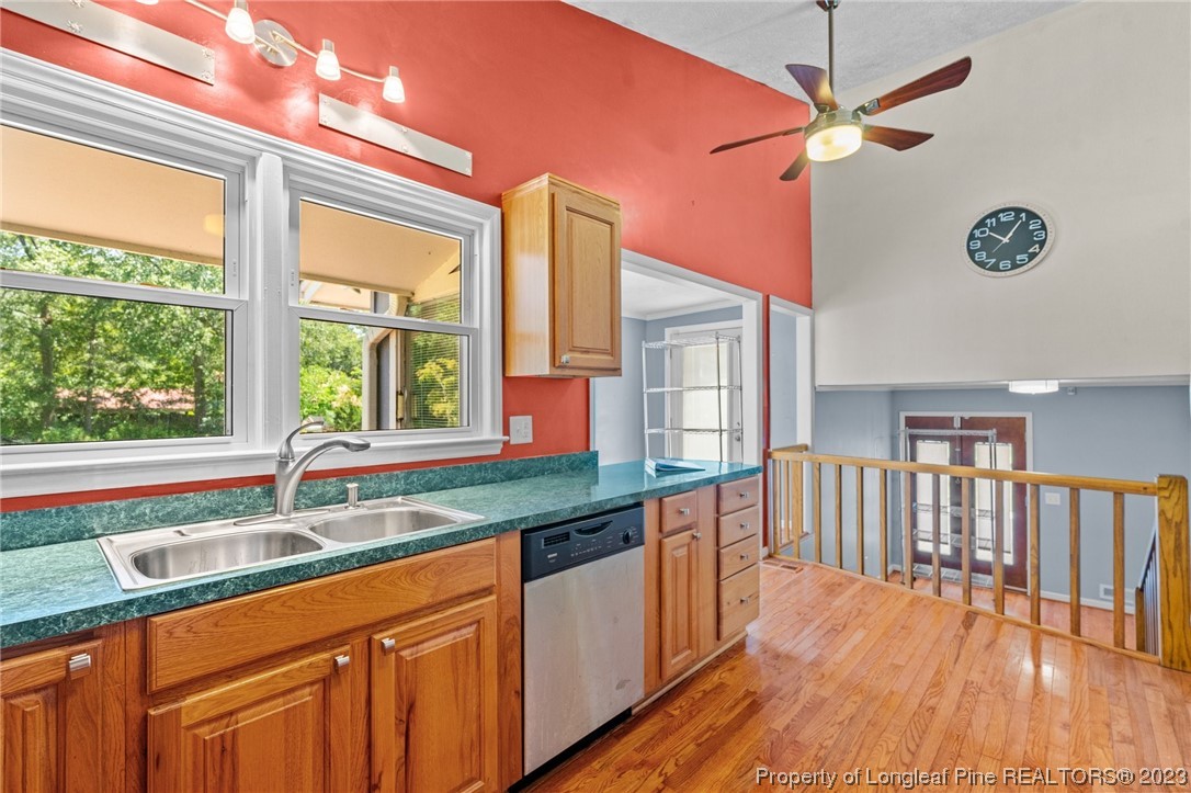 1812 Bainbridge Road Stedman, NC 28391 - Photo 5 of 30 a kitchen with stainless steel appliances granite countertop a sink a counter space and a window