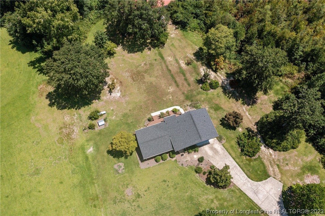 1812 Bainbridge Road Stedman, NC 28391 - Photo 9 of 30 an aerial view of a house with a yard and lake view